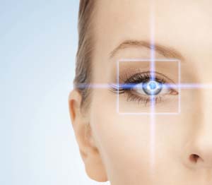 Digital white square and cross of blue light over a woman's eye.